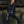 Load image into Gallery viewer, women siting on a rock wearing V net top, moto leggings, leather belt phone case with metal key clip