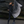 Load image into Gallery viewer, women standing in front of a black rock holding a black and white tie dye linen scarf