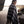 Load image into Gallery viewer, women standing on the beach wearing a black and white tie dye linen scarf with leather tassels