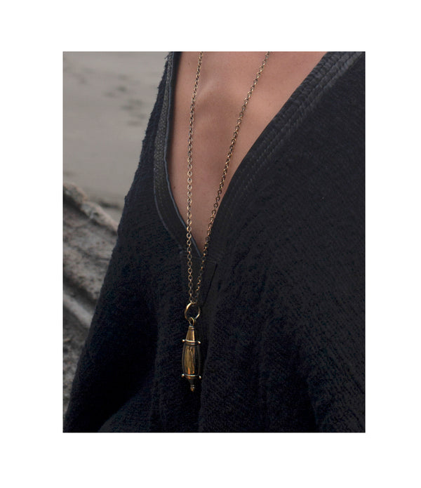 Gorgeous brass bottle pendant on matching chain.  Twists open to reveal a spike perfect for dabbing on your favorite perfume. A necklace of my design, the tear drop bottle has been hand cast.