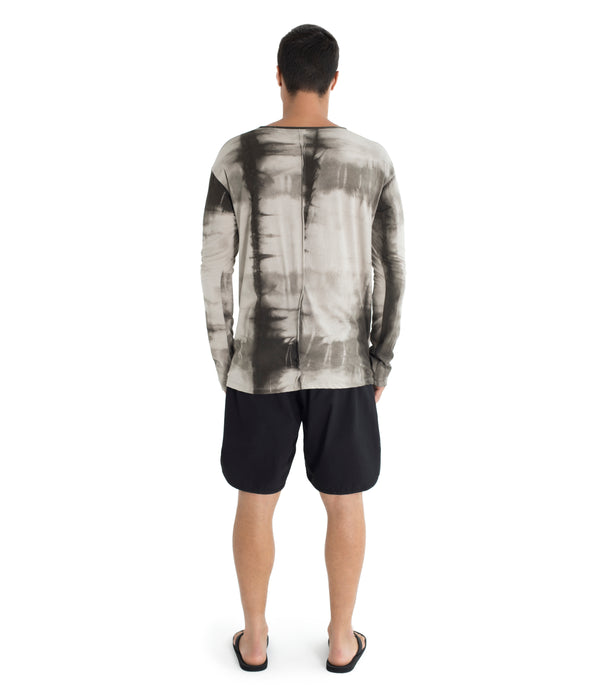 Shibori, relax fit long sleeve shirt crafted from light weight certified organic cotton.  With 2 asymmetrical seam lines on its front, and 1 vertical seam running down its back this shirt is simple yet unique and original. Hand dyed with plants.