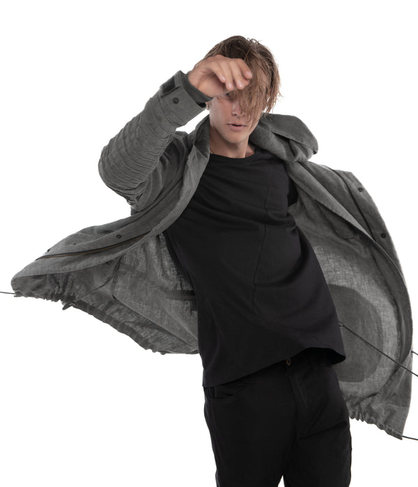 light weight linen parka. Featuring large lined hood, hidden snaps over front zip fastening, long sleeves with ribbed detail,
