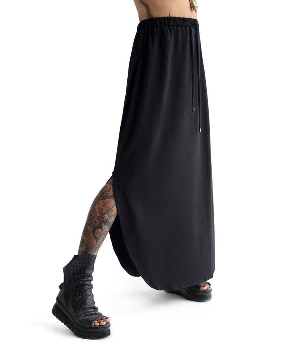 long skirt. Made of ultra soft bamboo & GOTS certified organic cotton blend.  Approx 39" from waist to ground. Made in Small Batches.  Elastic waist band with tie strings finished with custom metal caps.