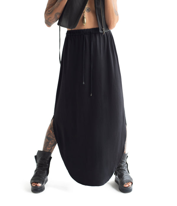 long skirt. Made of ultra soft bamboo & GOTS certified organic cotton blend.  Approx 39" from waist to ground. Made in Small Batches.  Elastic waist band with tie strings finished with custom metal caps.