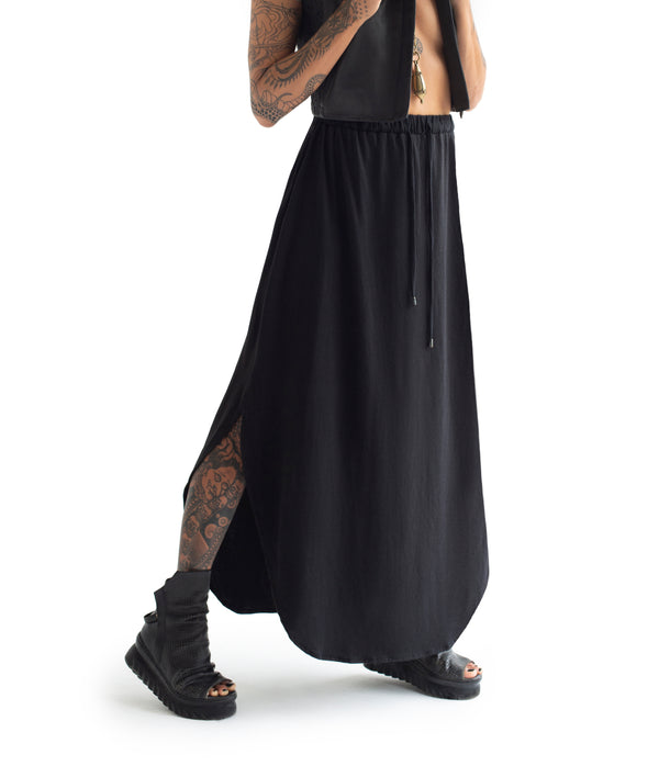 long skirt. Made of ultra soft bamboo & GOTS certified organic cotton blend.  Approx 39" from waist to ground. Made in Small Batches.  Elastic waist band with tie strings finished with custom metal caps