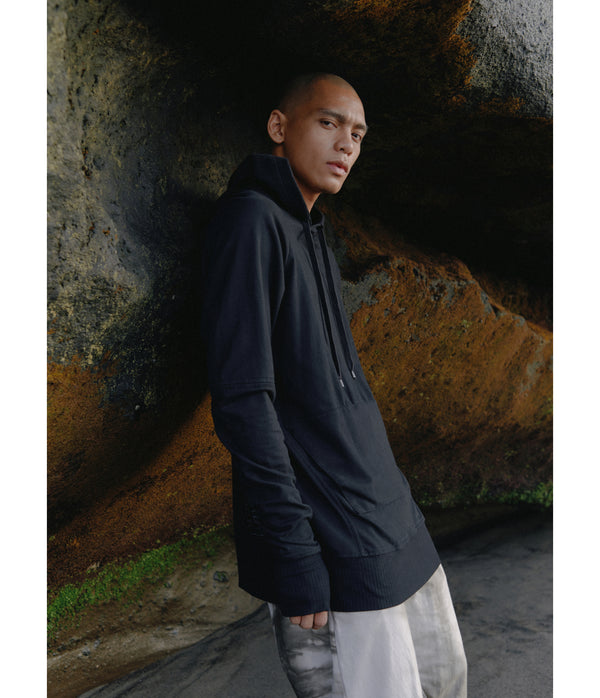 Drawstring hoodie sweatshirt crafted from medium weight cotton terry finished with ecovero* ribbing, lined hood. Hand dyed with plant with shibori method.