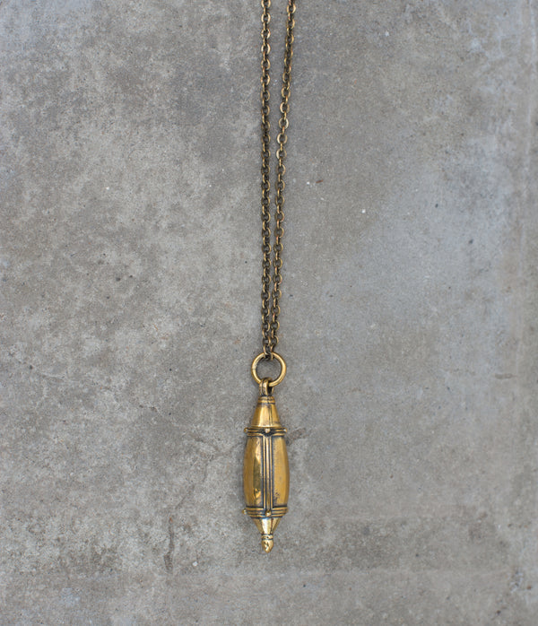 Gorgeous brass bottle pendant on matching chain.  Twists open to reveal a spike perfect for dabbing on your favorite perfume. A necklace of my design, the tear drop bottle has been hand cast.