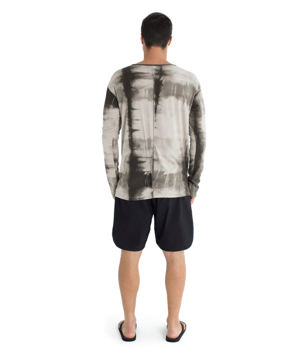Shibori, relax fit long sleeve shirt crafted from light weight certified organic cotton.  With 2 asymmetrical seam lines on its front, and 1 vertical seam running down its back this shirt is simple yet unique and original. Hand dyed with plants. 