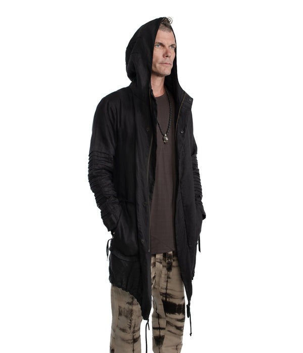 100% linen parka. Made of light weight linen. Featuring large lined hood, front frayed edge pockets, leather details, leather tassel zip on outside chest pocket, inside chest pocket, and drawstring hem.